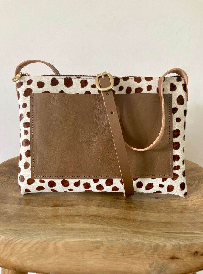 Brown-cheetah-crossover-bag-cream-brown-spot-gold-zip-brass-buckle-brown-adjustable-strap-back-view-pocket-minimalist-style-moco