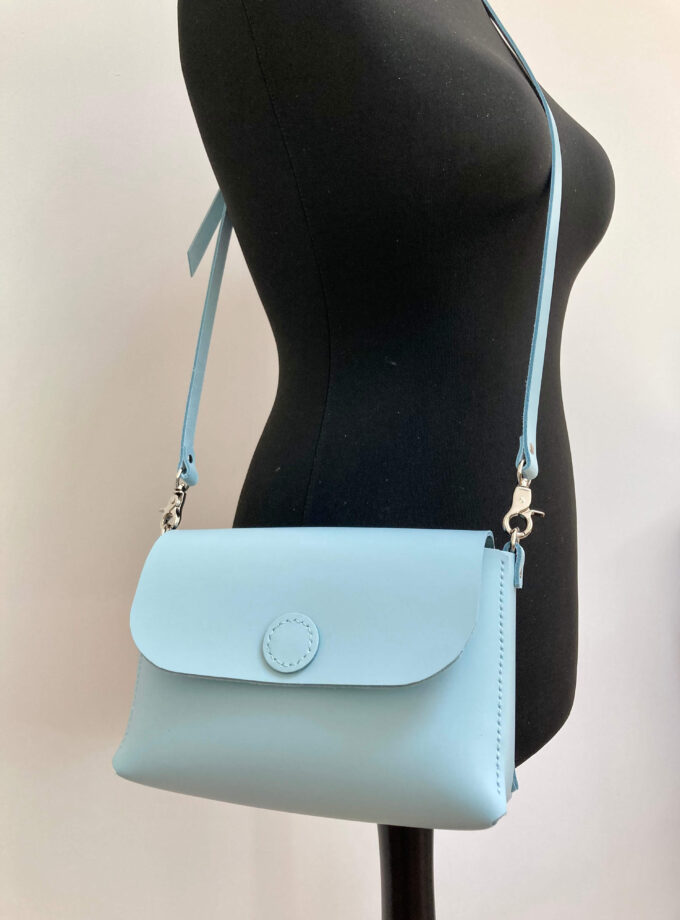 baby-blue-handmade-leather-bag-on-mannequin-minimalist-style