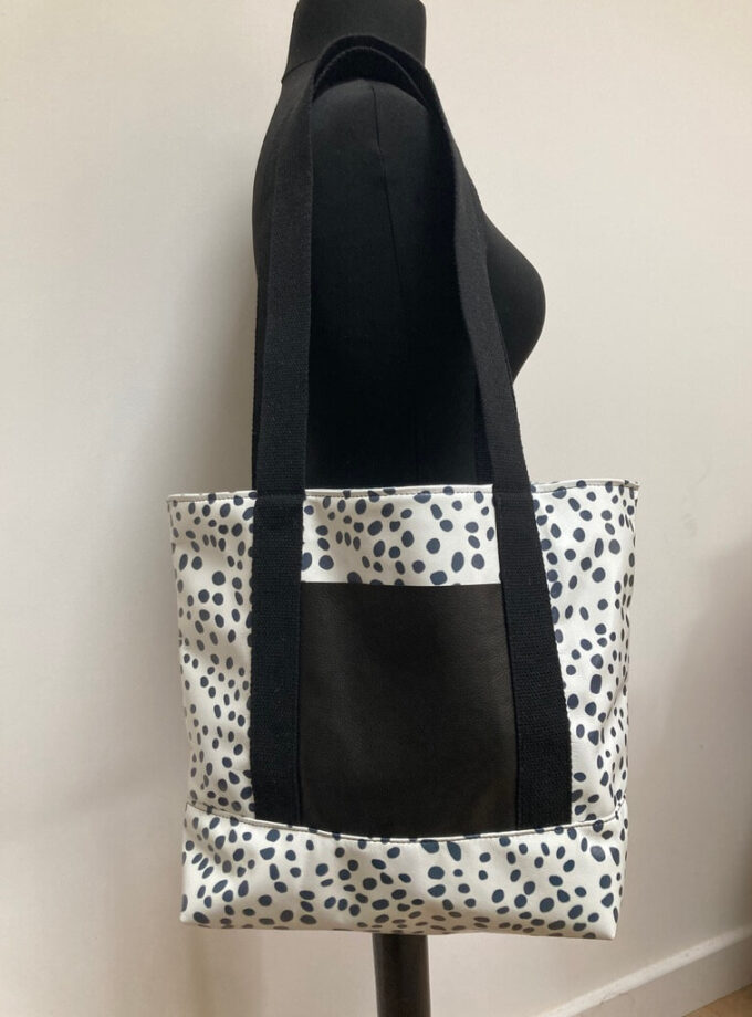 handmade-cheetah-spots-leather-tote-external-pocket-fabric-straps-on-mannequin-front-view