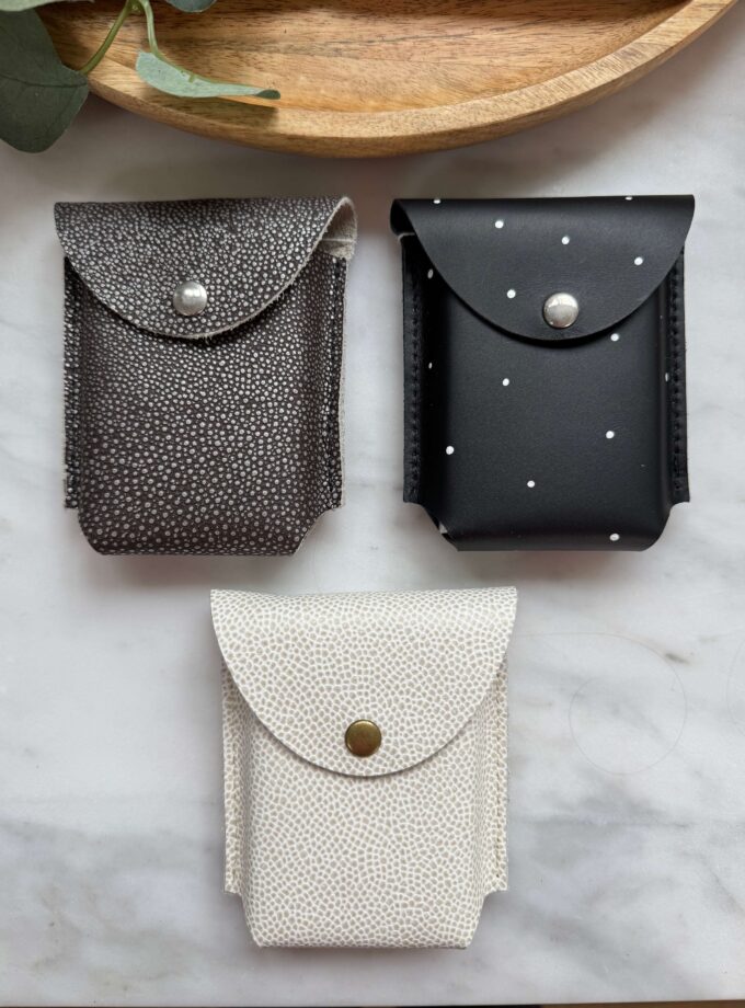 cream-black-pebbled-black-white-spot-leather-card-cases-closed